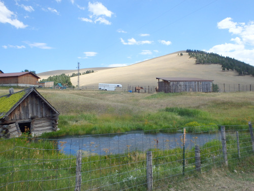 GDMBR: An old dwelling is sinking into a new pond.